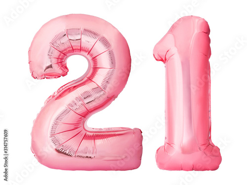 Number 21 twenty one made of rose gold inflatable balloons isolated on white background. Pink helium balloons forming 21 twenty one number. Legal age birthday concept