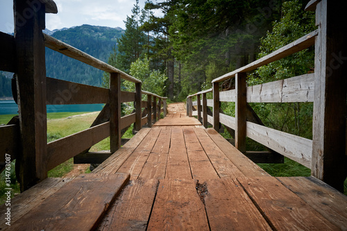 Fototapeta Naklejka Na Ścianę i Meble -  Wooden bridge in the mountains