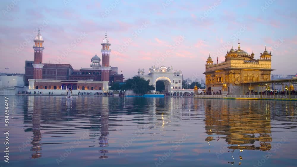 India, Punjab, Amritsar, (Golden Temple), The Harmandir Sahib, Amrit Sagar (lake of Nectar), illuminated at dusk India, Punjab, Amritsar, (Golden Temple), The Harmandir Sahib, Amrit Sagar (lake of Nectar), illuminated at dusk