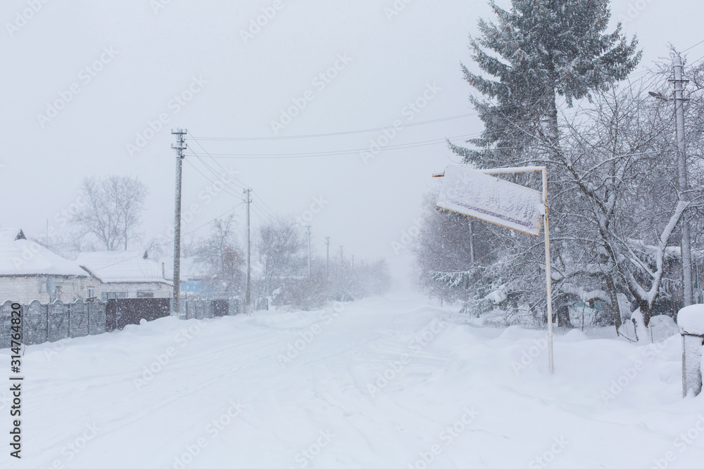 Winter, rural streets are covered with snow. Snow blizzard Winter, rural streets are covered with snow. Snow blizzard