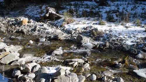 Cinematic slow motion video - throwing rocks / stones in a river in Arges, Romania