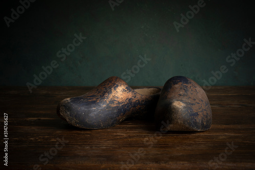 Canvas Print A pair of clogs or wooden shoes typical for the Dutch culture in a stillife sett