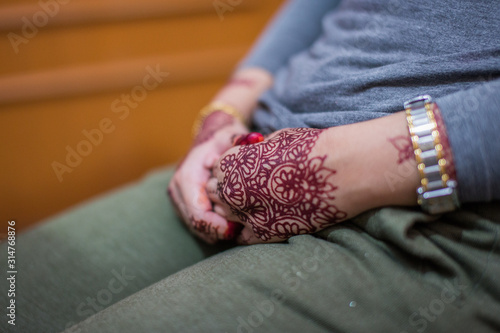Very beautiful and unique henna paintings on both hands of the bride.