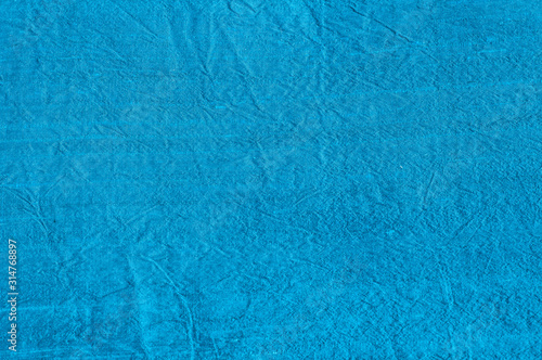 Blue silk shantung fabric texture closeup as textile background photo