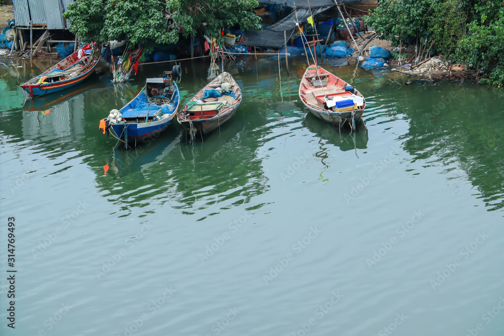 The fishing boat parked at the river