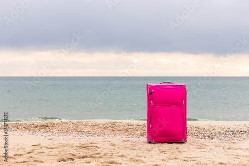 suitcase by the sea or ocean