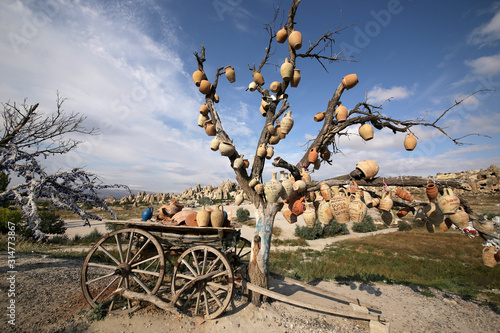 Goreme, Turkey - 09/15/2009: A tree decorated with souvenir pottery in the vicinity of the Goreme village in the Cappadocia region of Turkey.