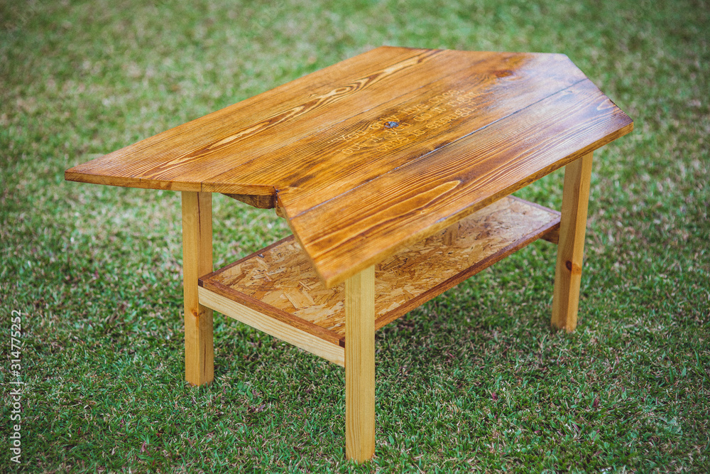 A bench with geometric design made of used pallet wood. A bench with geometric design made of used pallet wood.