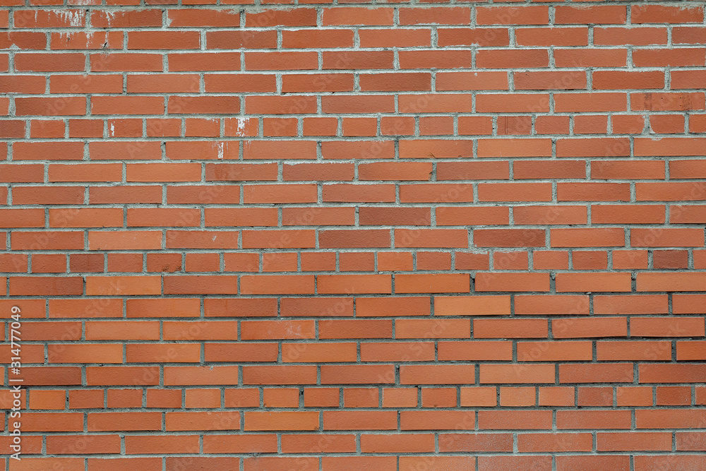 Fototapeta premium background of a red and orange brick wall. 