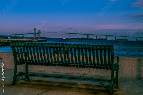Metal bench with Newport bridge in the background