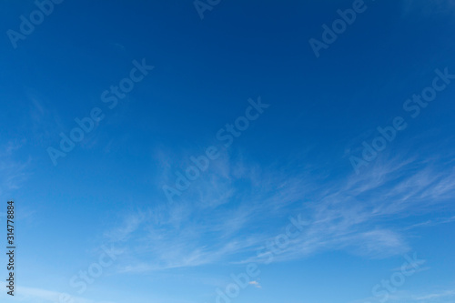 Clear blue sky with clouds for background picture.