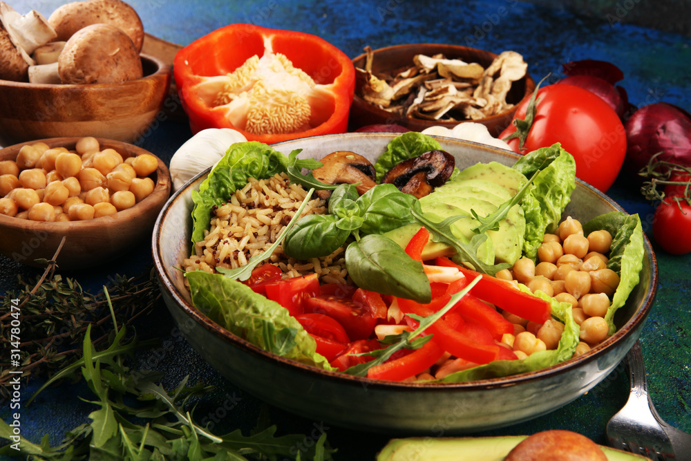 Quinoa and spicy chickpea vegetable vegetarian buddha bowl. Healthy food concept with tomato