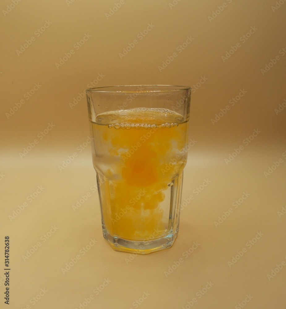 Glass of water with burst of color from water enhancer Glass of water with burst of color from water enhancer