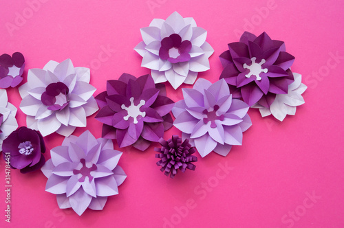 Flowers made of paper. Pink background.