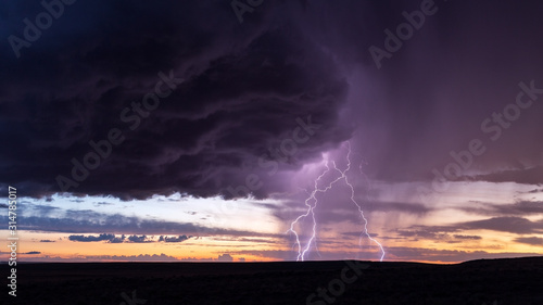 Thunderstorm lightning strike at sunset