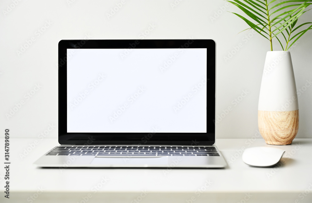 Fototapeta premium Laptop computer with blank screen in office