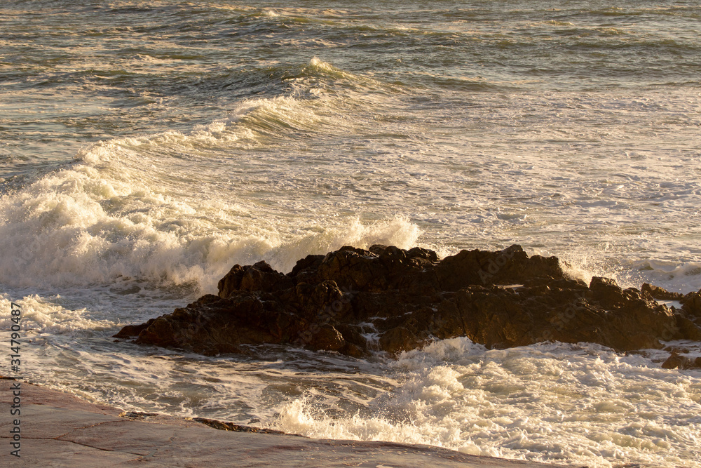 Wave hitting the rocks