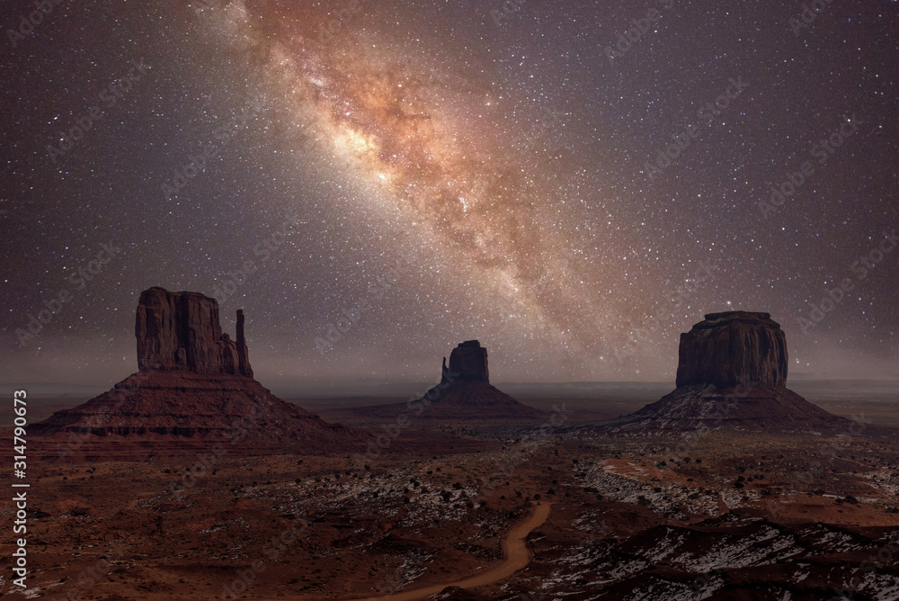 Milky Way long exposure photo in Monument Valley - obrazy, fototapety, plakaty 