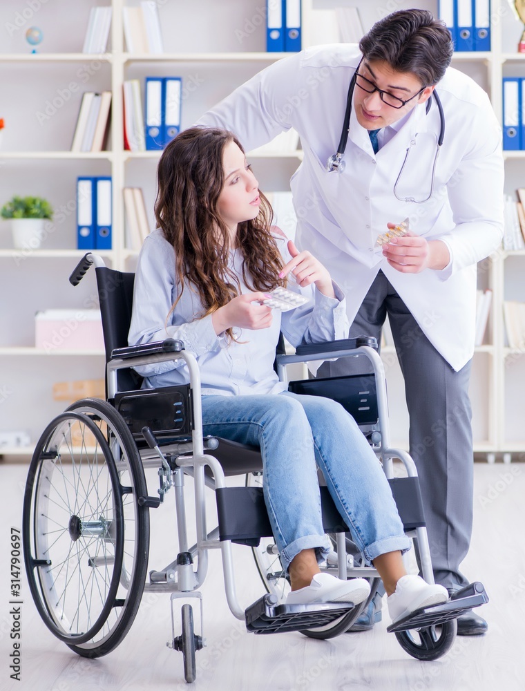 Disabled patient on wheelchair visiting doctor for regular check Disabled patient on wheelchair visiting doctor for regular check