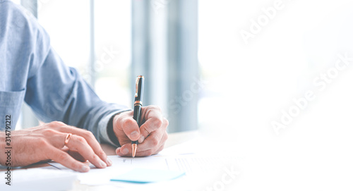 Close up of hand Caucasian young businessman signing a contract. About the financial business in the office. Panoramic web banner on white background with copy space concept.