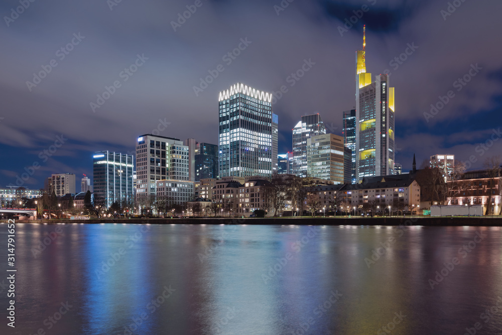 The Skyline of Frankfurt by night, seen from the river Main.
