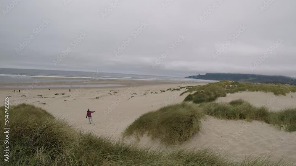 Running down the sand dunes on the Oregon Coast Running down the sand dunes on the Oregon Coast
