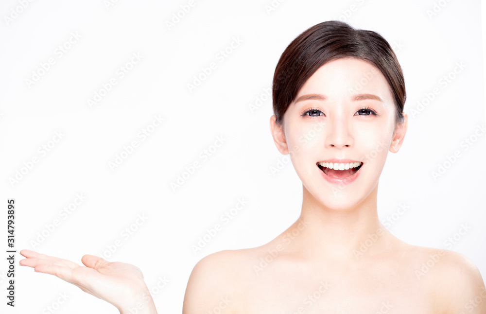 young beauty showing empty copy space on the open hand palm young beauty showing empty copy space on the open hand palm