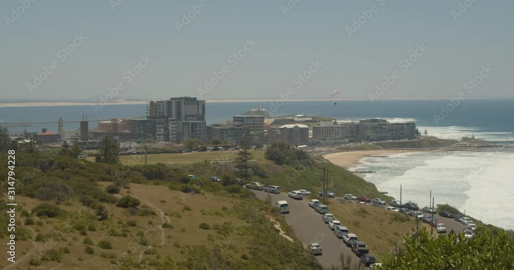 View of the City of Newcastle, with hang gliders flying over Newcastle Beach, New South Wales, Australia View of the City of Newcastle, with hang gliders flying over Newcastle Beach, New South Wales, Australia