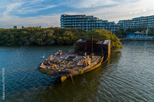 Rust old abandoned ship wreck in Sydney, Homebush photo