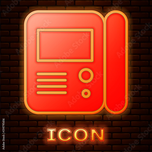 Glowing neon House intercom system icon isolated on brick wall background. Vector Illustration