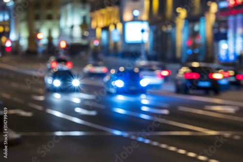 night street in the city with cars in motion. blurred traffic at night 