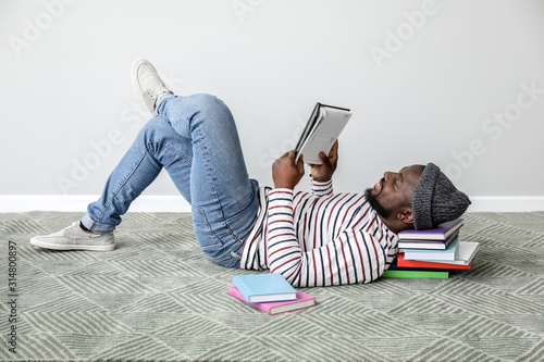 African-American man readin...