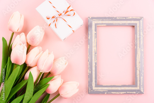Happy Women's Day, Mother's Day concept. top view flat lay photo frame, gift box and Tulip flower © sorapop