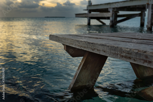 Relaxing bench in a calm ocean