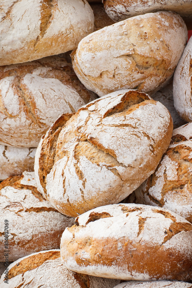 Fresh wholegrain loaves of rye or wheat bread