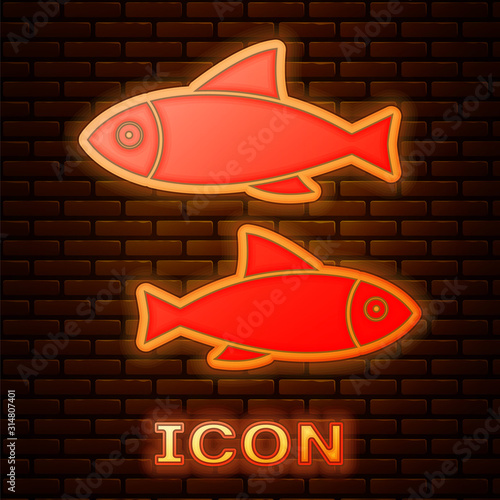 Glowing neon Fish icon isolated on brick wall background. Vector Illustration