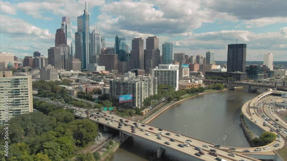 Aerial: Philadelphia city skyline & freeway traffic crossing the Schuylkill River, Pennsylvania, USA Aerial: Philadelphia city skyline & freeway traffic crossing the Schuylkill River, Pennsylvania, USA