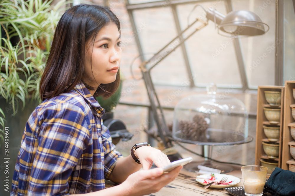Business women hand use smartphone online chatting in coffee shop Business women hand use smartphone online chatting in coffee shop