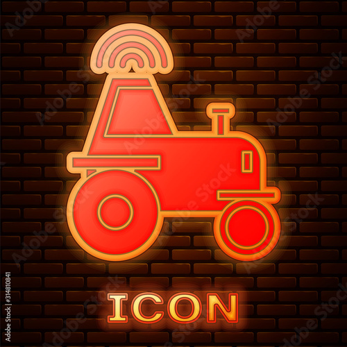 Glowing neon Self driving wireless tractor on a smart farm icon isolated on brick wall background. Smart agriculture implement element. Vector Illustration