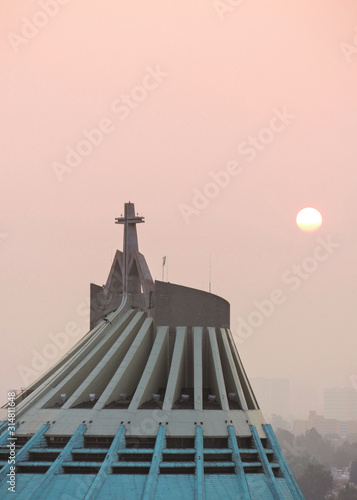 A catholich church during a sunset