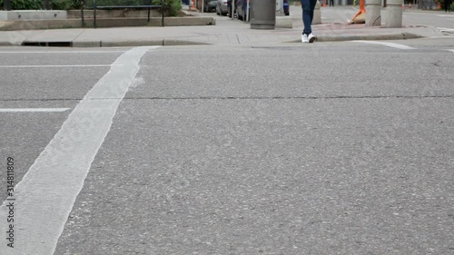 Wallpaper Mural POV at lower level of street lane while car passing and a girl crossing the street Torontodigital.ca