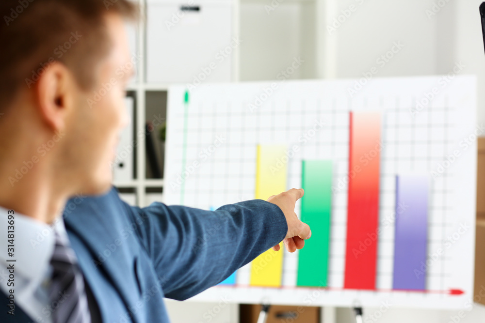 Man in suit point with arm in stats graph in office closeup. Stock exchange market advisor sale examination industry profit research occupation account career present ambition negotiation study trade Man in suit point with arm in stats graph in office closeup. Stock exchange market advisor sale examination industry profit research occupation account career present ambition negotiation study trade