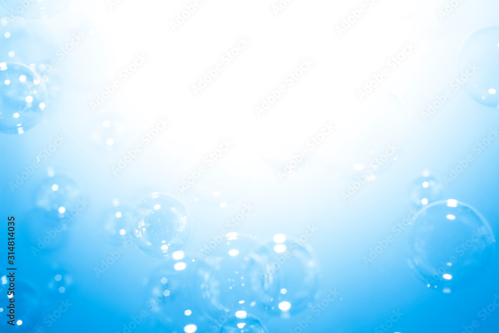 Blue soap bubbles background with copy space