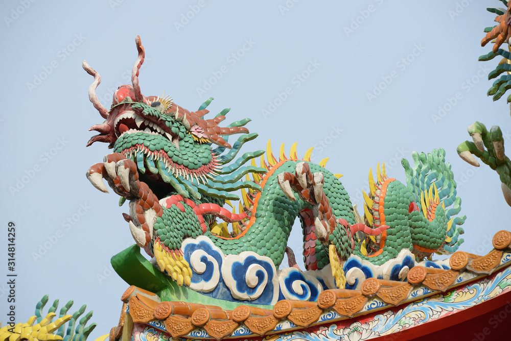 chinese dragon statue on the roof of temple chinese dragon statue on the roof of temple