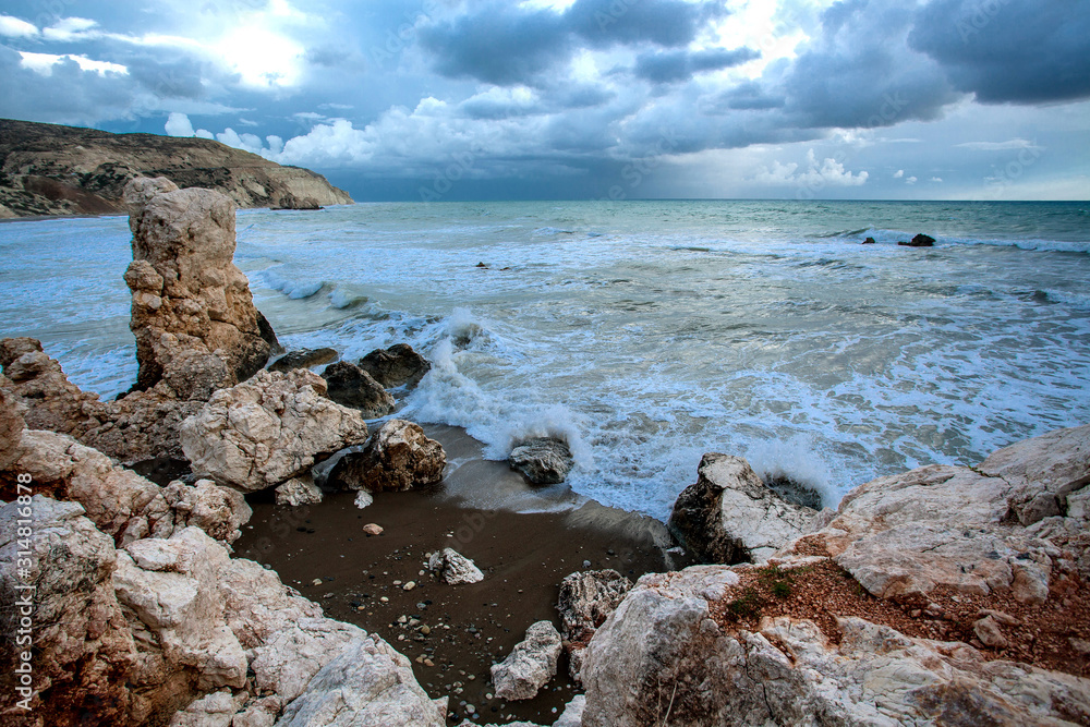 Beautiful landscape sunset in the sea with stones and mountains Beautiful landscape sunset in the sea with stones and mountains