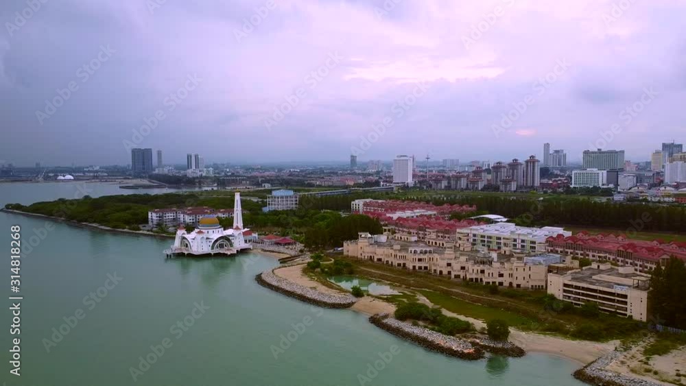 Aerial wide shot of big melaka city beside river,harbor and famous mosque on bank Aerial wide shot of big melaka city beside river,harbor and famous mosque on bank