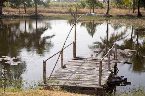 homemade bamboo dock on fishing pond