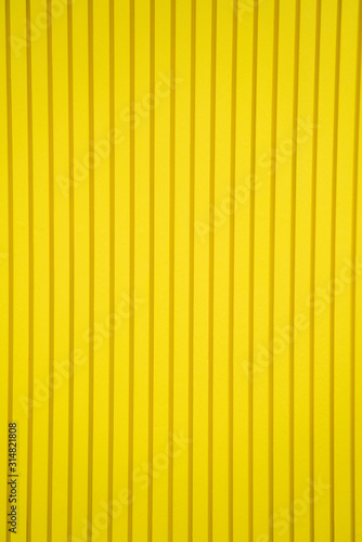 Abstract pattern of yellow background with straight lines textured. wooden material room wallpaper interior decorative, modern style, copy space.