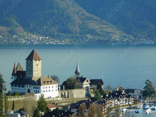Spiez Castle and landscape with lake and mountains, Switzerland