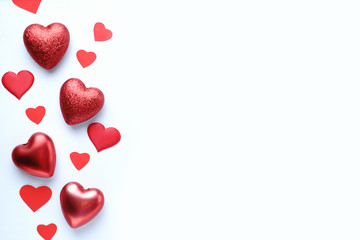 Valentine's, Mother's or Women's Day greeting card, banner or poster template. Holidays background with festive red heart shaped decorations and empty background with place for text design